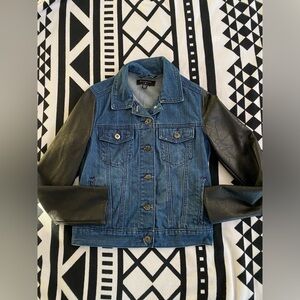 Dark denim jean jacket with faux leather sleeves